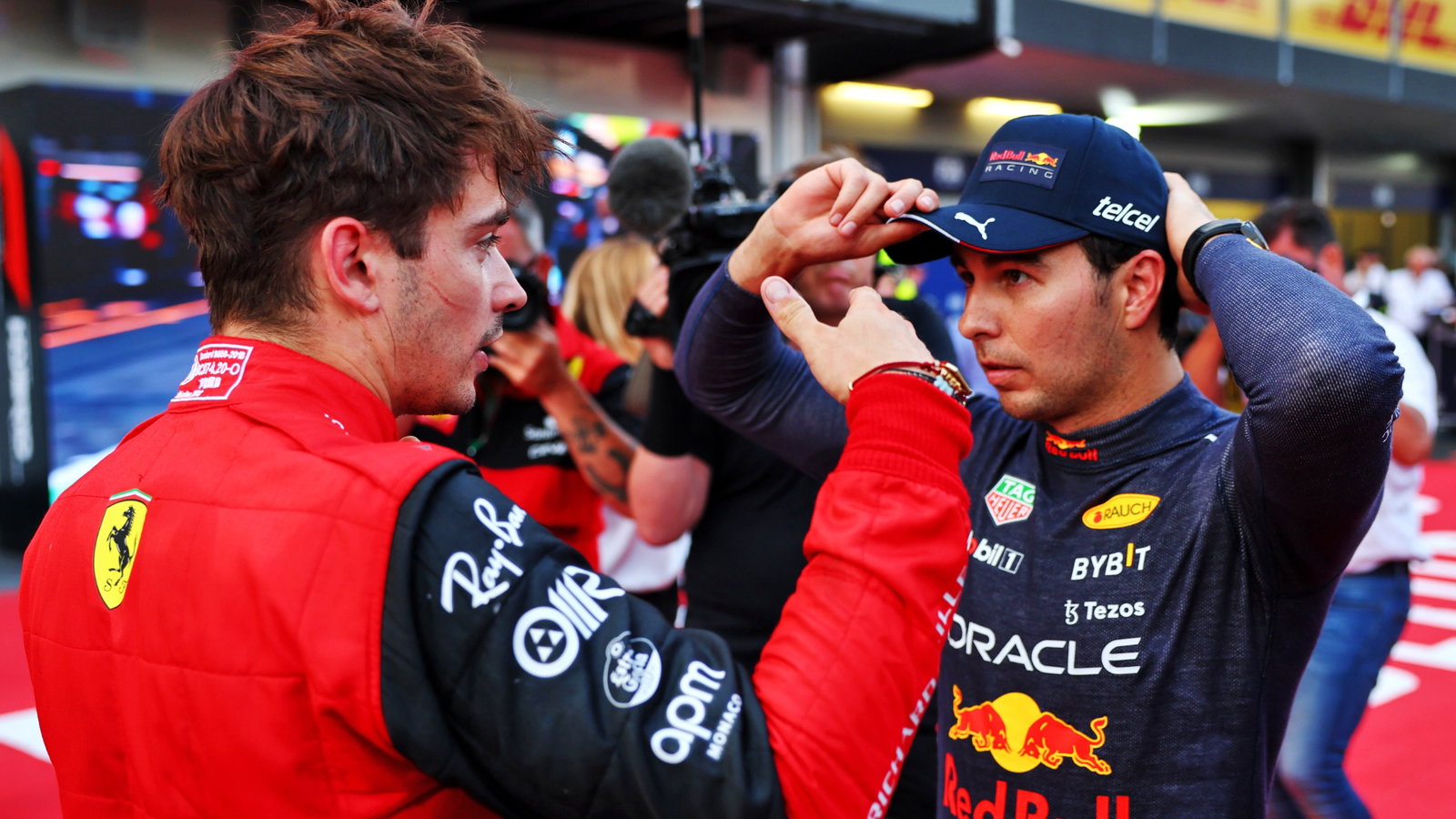 (L to R): Pole sitter Charles Leclerc (MON) in qualifying parc ferme with Sergio Perez (MEX)