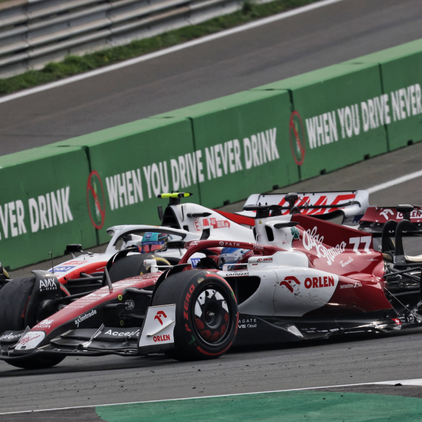 Mick Schumacher (GER) Haas VF-22 and Valtteri Bottas (FIN) Alfa Romeo F1 Team C42 battle for position. Formula 1 World