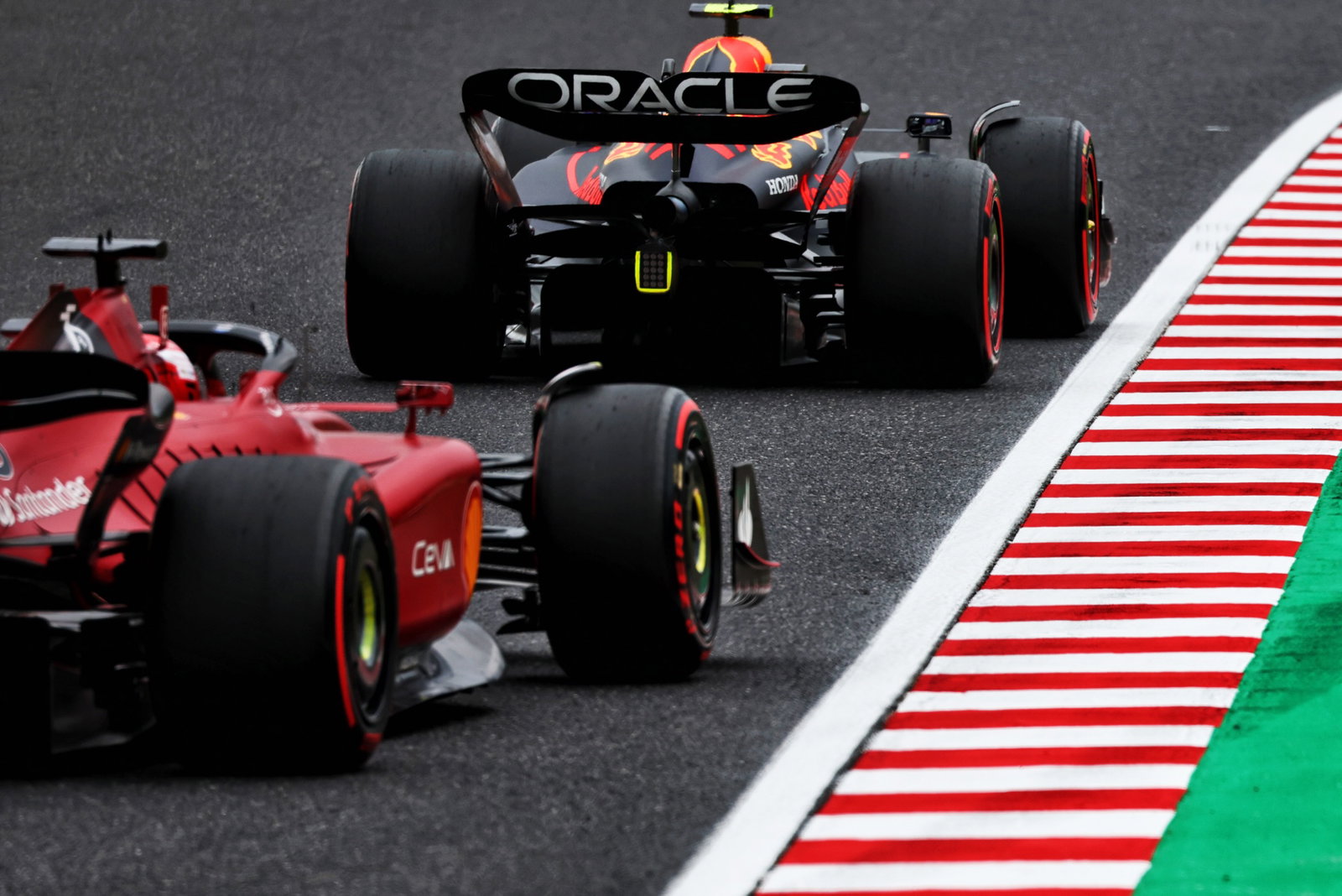 Sergio Perez (MEX) Red Bull Racing RB18 leads Charles Leclerc (MON) Ferrari F1-75. Formula 1 World Championship, Rd 18,