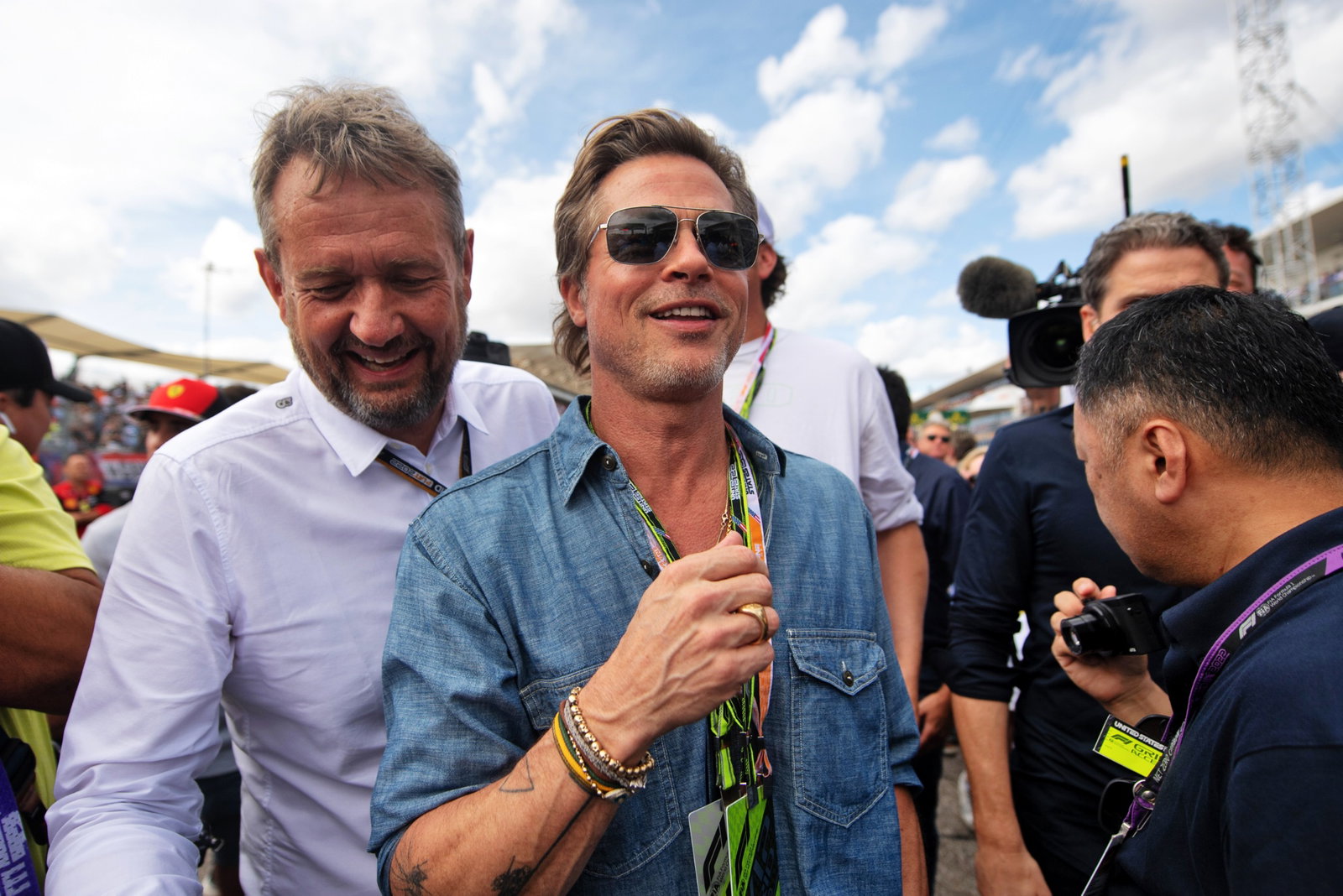 Brad Pitt (USA) Actor with Steve Nielsen (GBR) FOM Sporting Director on the grid. Formula 1 World Championship, Rd 19,