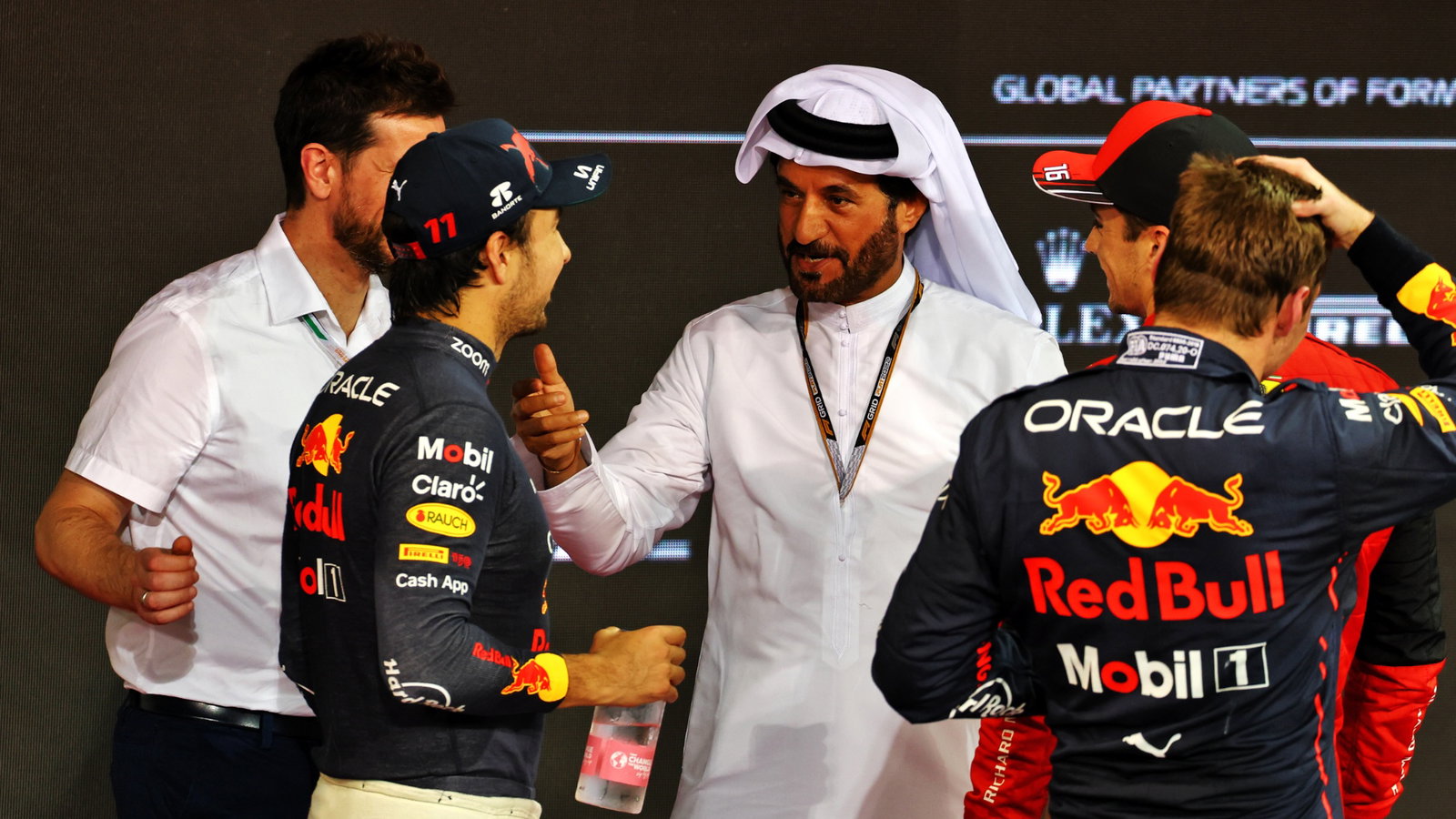 (L to R): Sergio Perez (MEX) Red Bull Racing with Mohammed Bin Sulayem (UAE) FIA President; Charles Leclerc (MON) Ferrari;