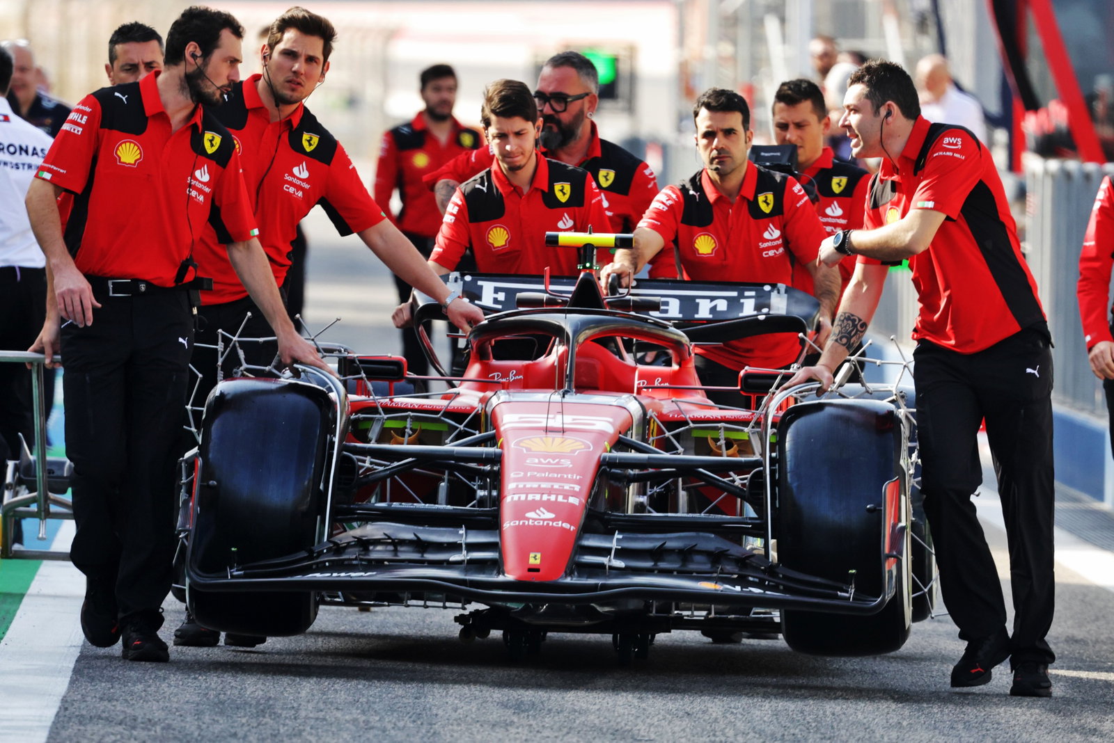 Ferrari SF-23 pushed down the pit lane by mechanics. Formula 1 Testing, Sakhir, Bahrain, Day One.- www.xpbimages.com,