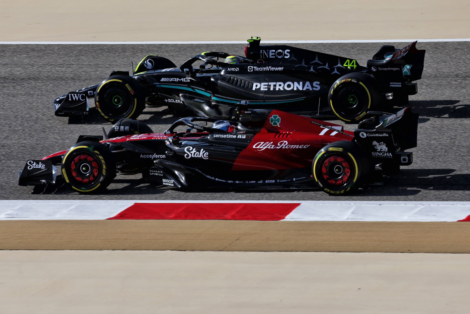 Valtteri Bottas (FIN) Alfa Romeo F1 Team C43 and Lewis Hamilton (GBR) Mercedes AMG F1 W14. Formula 1 World Championship,