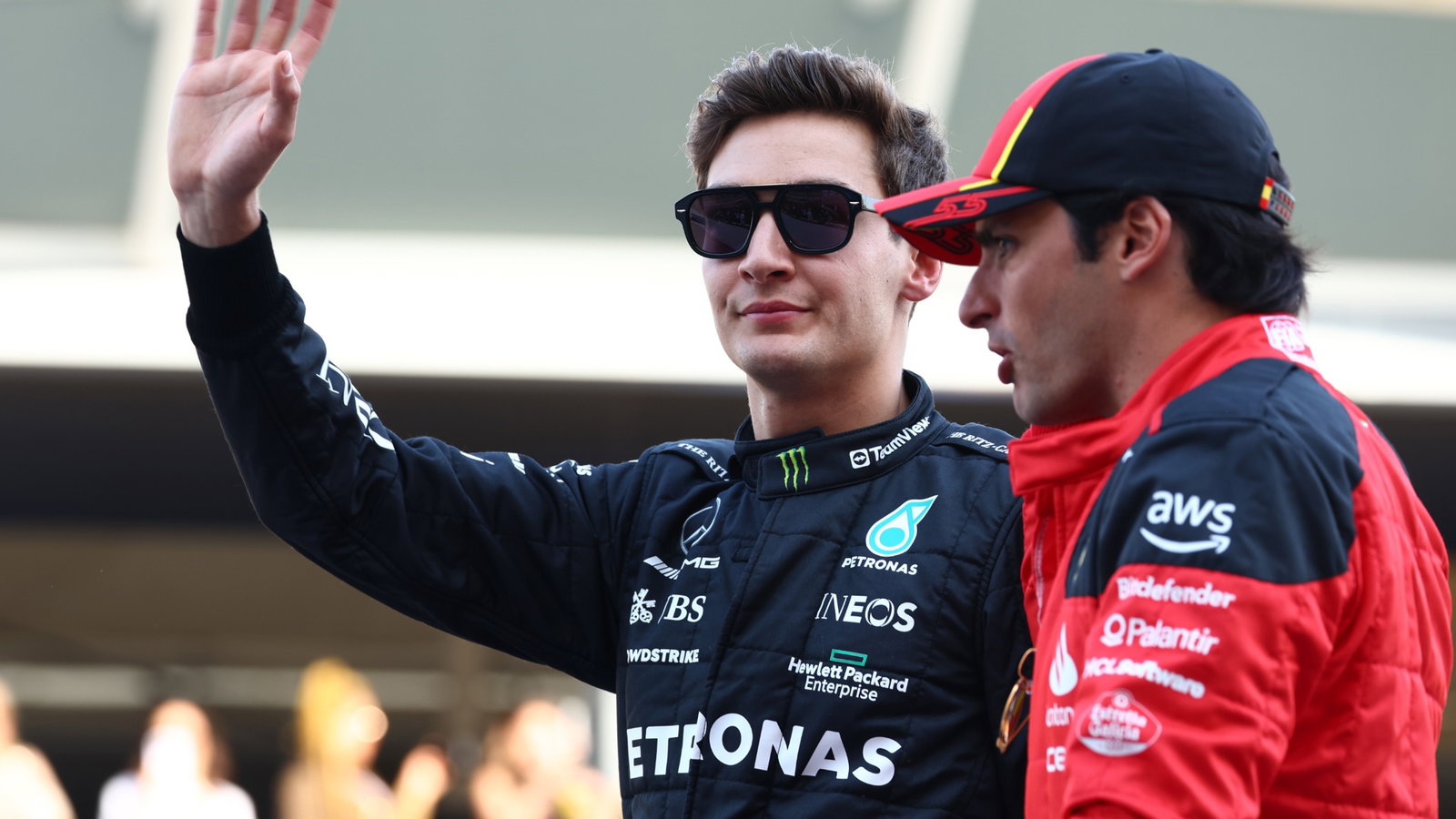 (L to R): George Russell (GBR) Mercedes AMG F1 and Carlos Sainz Jr (ESP) Ferrari on the drivers' parade. Formula 1 World