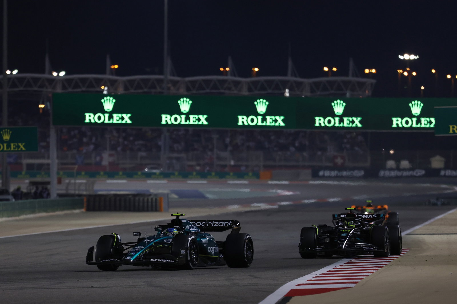 Fernando Alonso (ESP) Aston Martin F1 Team AMR23 leads Lewis Hamilton (GBR) Mercedes AMG F1 W14. Formula 1 World