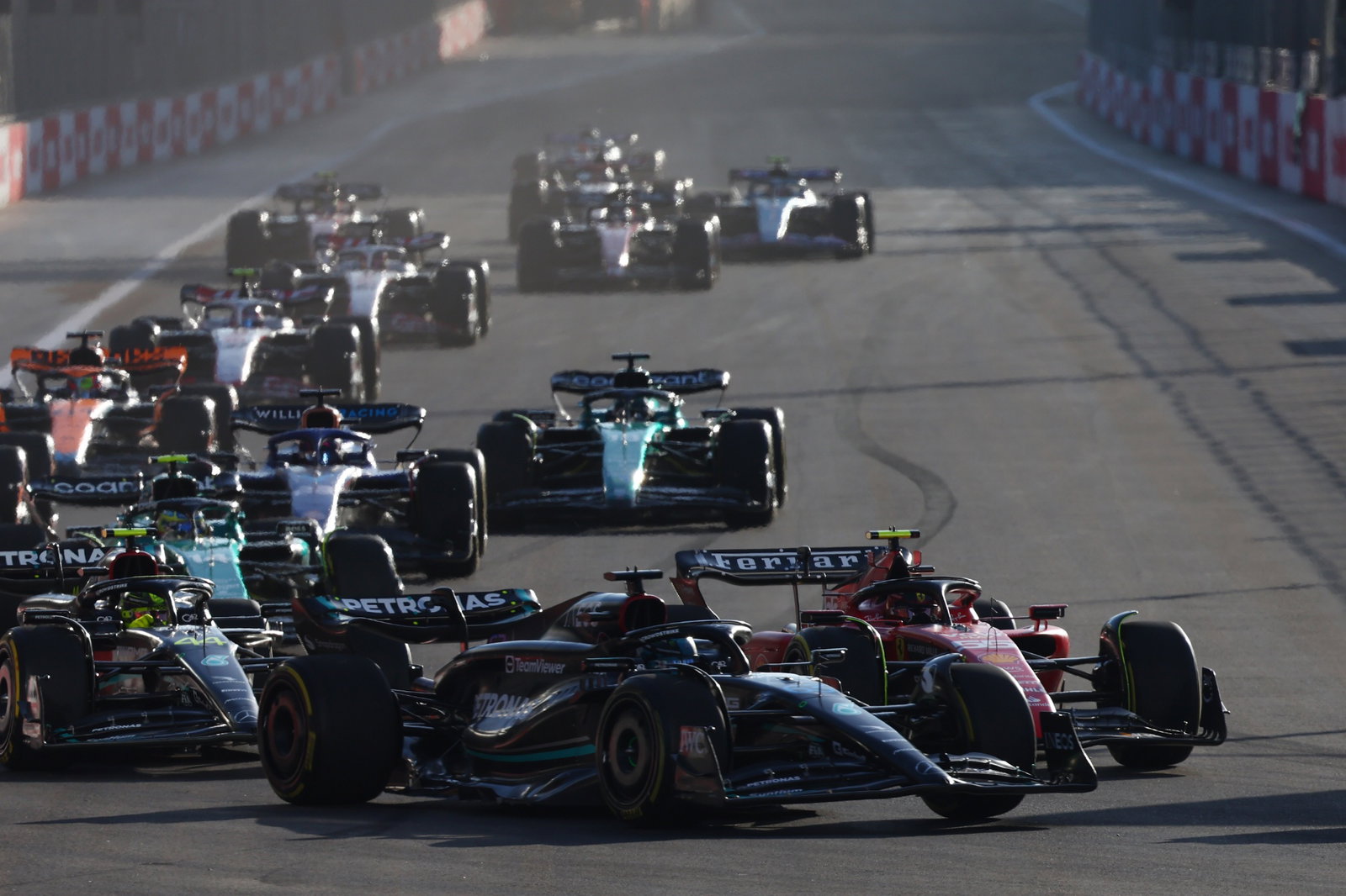 George Russell (GBR) Mercedes AMG F1 W14 and Sergio Perez (MEX) Red Bull Racing RB19 battle for position. Formula 1 World
