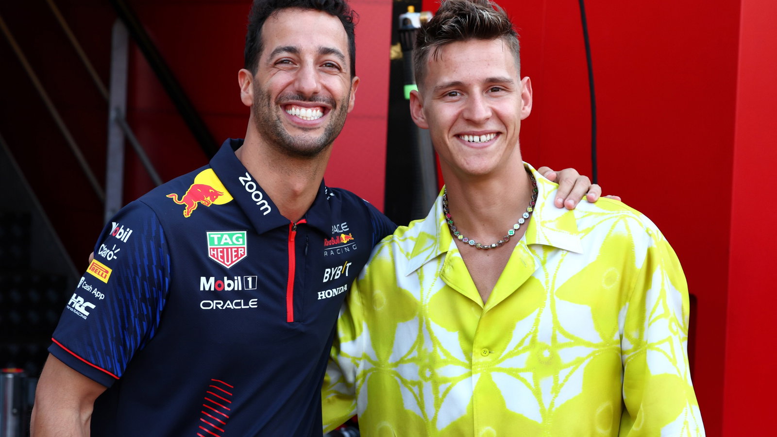 (L to R): Daniel Ricciardo (AUS) Red Bull Racing Reserve and Third Driver with Fabio Quartararo (FRA) MotoGP Motorcycle