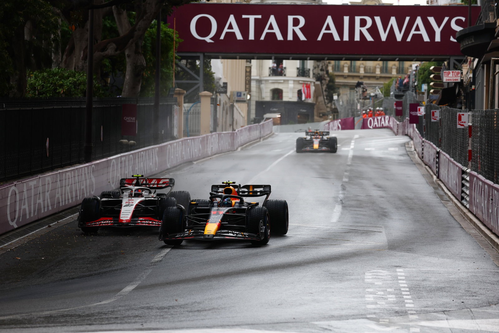 Sergio Perez (MEX) Red Bull Racing RB19 and Nico Hulkenberg (GER) Haas VF-23 battle for position. Formula 1 World