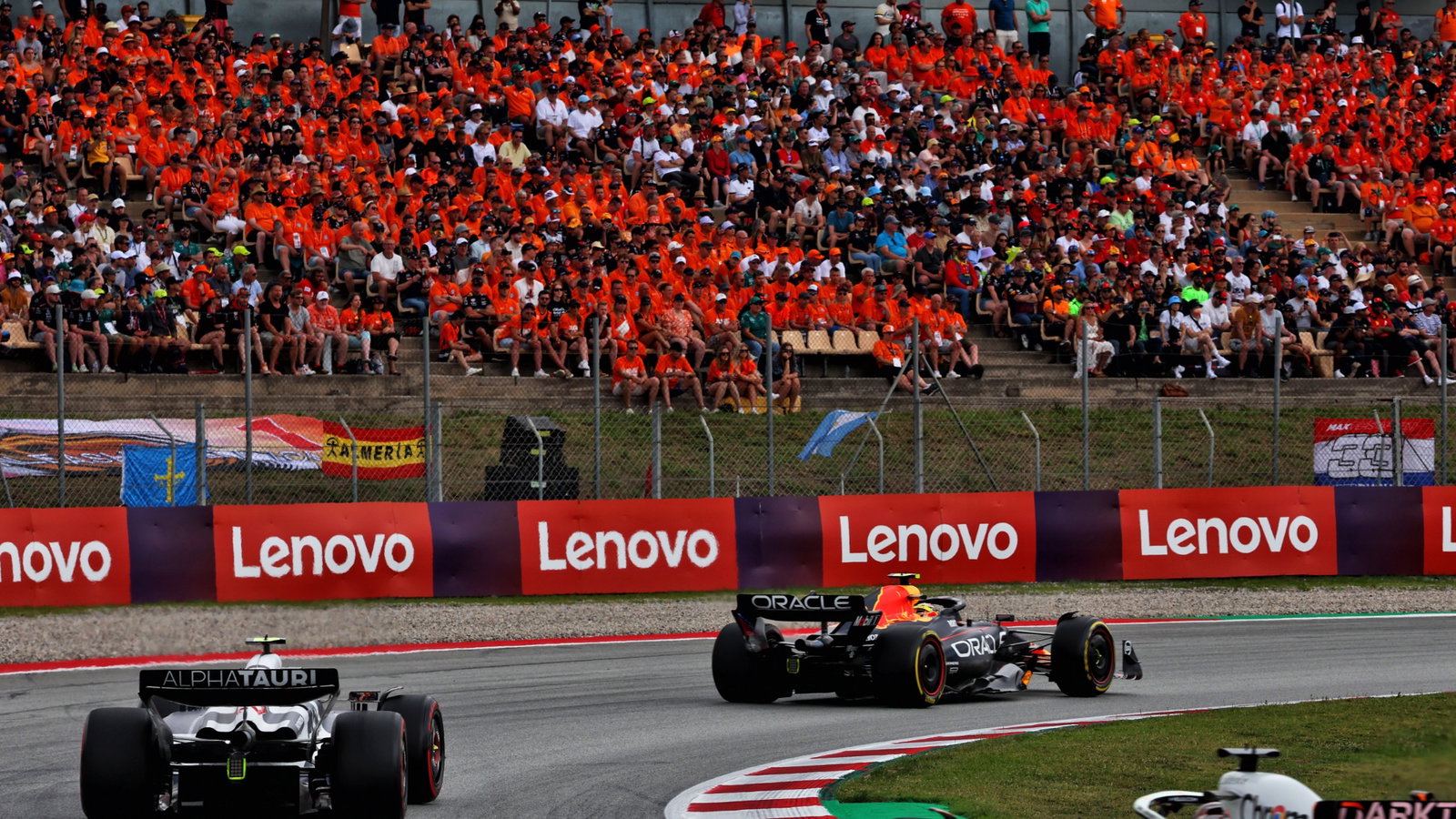 Sergio Perez (MEX) Red Bull Racing RB19 leads Yuki Tsunoda (JPN) AlphaTauri AT04. Formula 1 World Championship, Rd 8,
