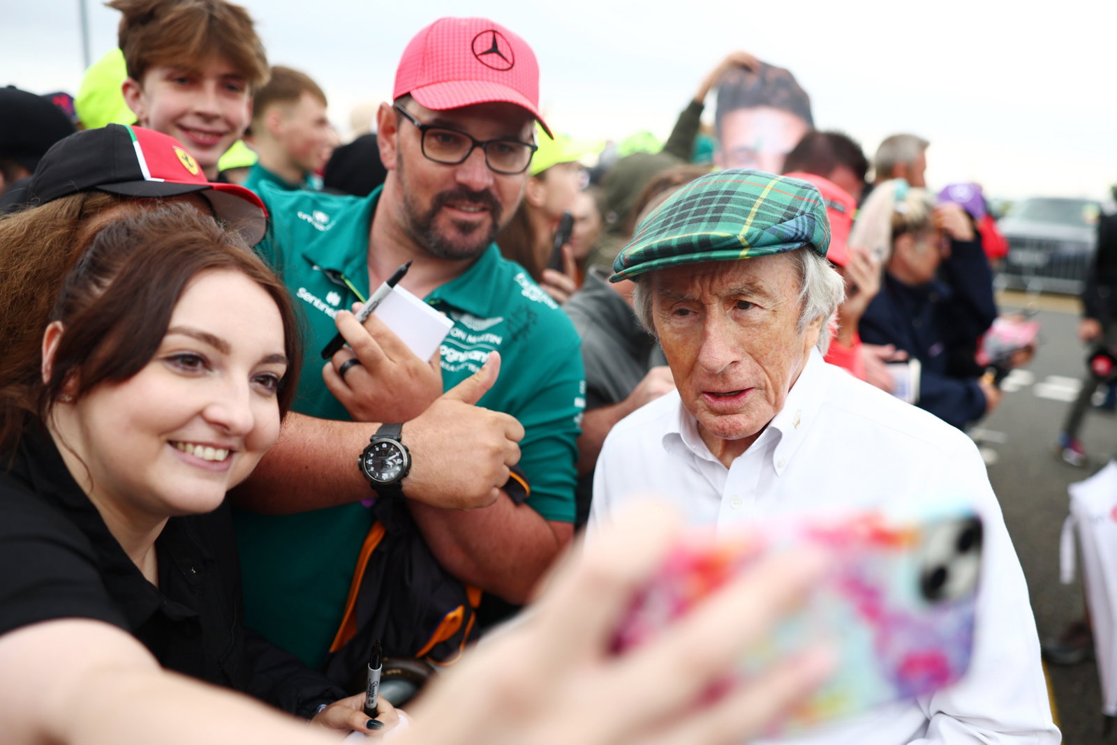 Jackie Stewart (GBR) with fans. Formula 1 World Championship, Rd 11, British Grand Prix, Silverstone, England, Race Day.