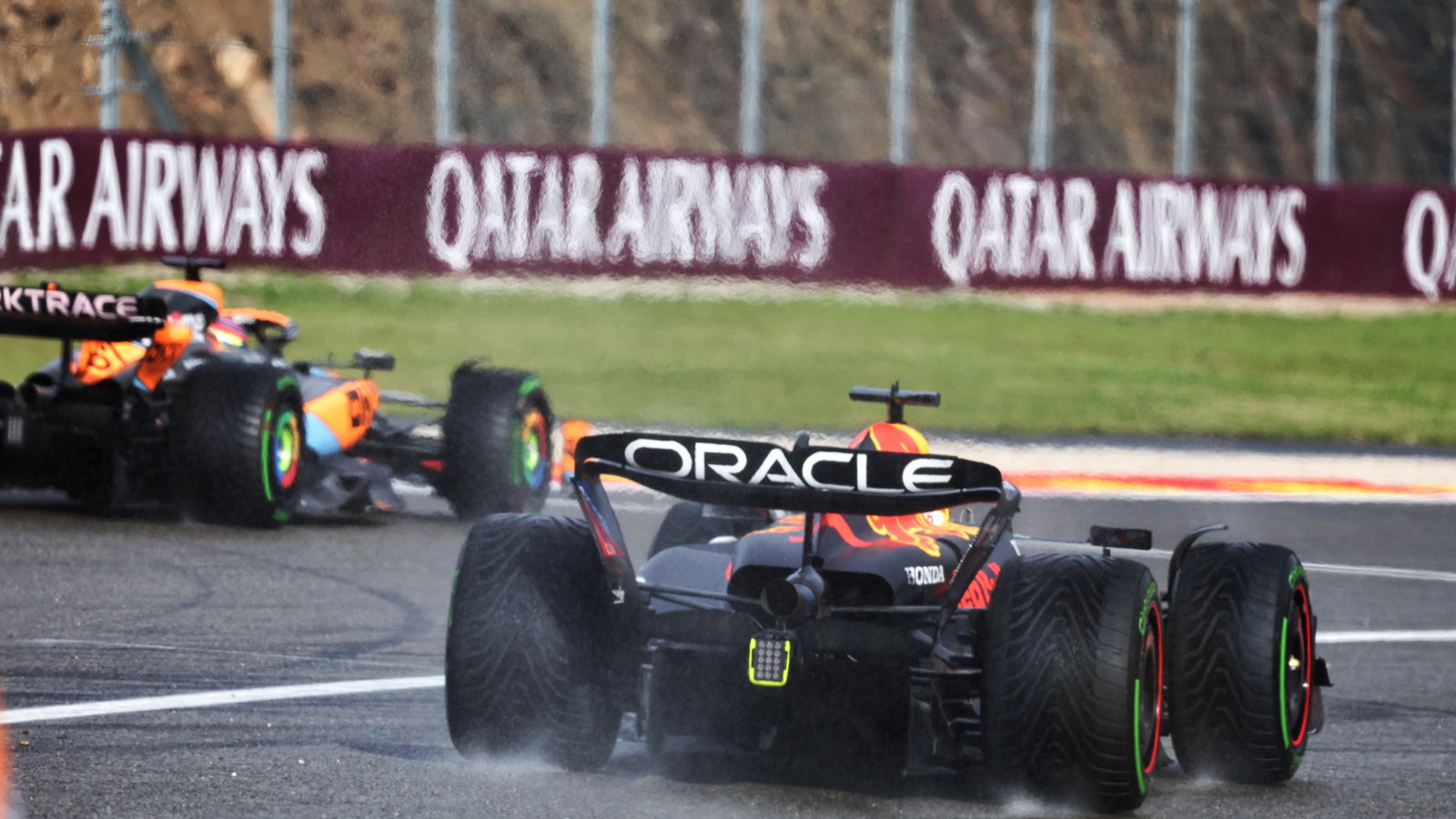 Max Verstappen (NLD) Red Bull Racing RB19 leaves the pits behind Oscar Piastri (AUS) McLaren MCL60. Formula 1 World