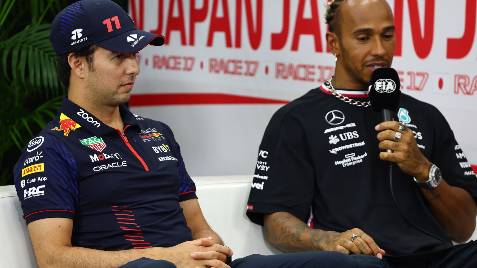 (L to R): Sergio Perez (MEX) Red Bull Racing and Lewis Hamilton (GBR) Mercedes AMG F1 in the FIA Press Conference. Formula