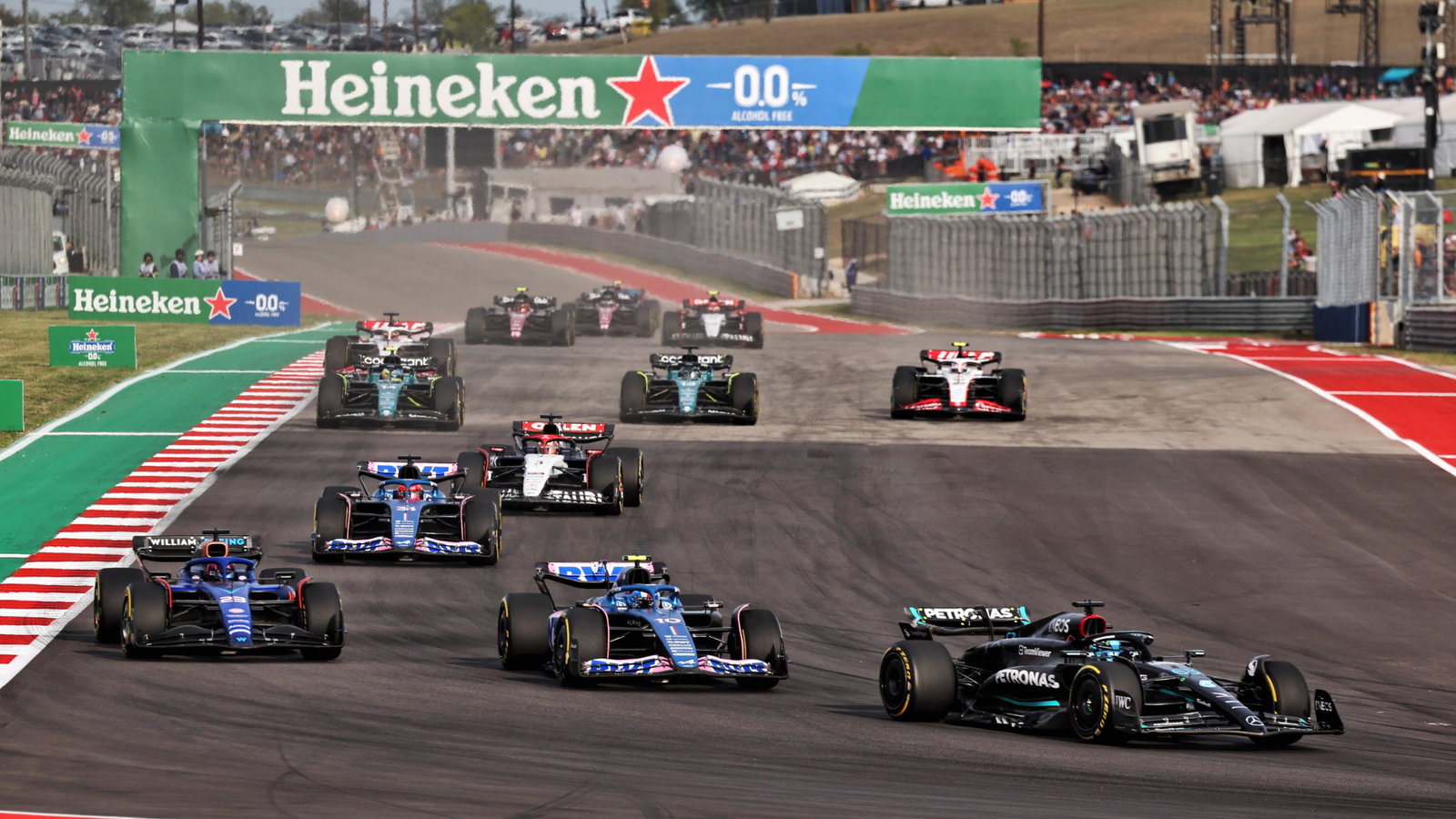 George Russell (GBR) Mercedes AMG F1 W14 leads Pierre Gasly (FRA) Alpine F1 Team A523 and Alexander Albon (THA) Williams