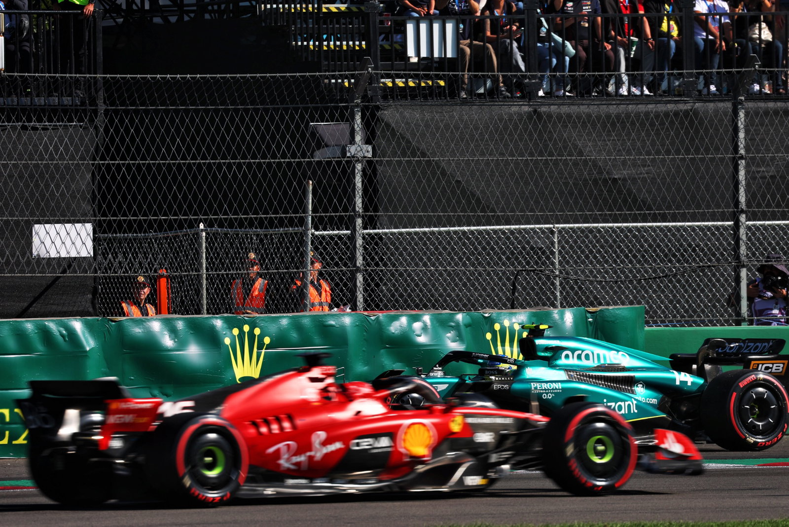 Charles Leclerc (MON) Ferrari SF-23 passes Fernando Alonso (ESP) Aston Martin F1 Team AMR23, who spun in qualifying.