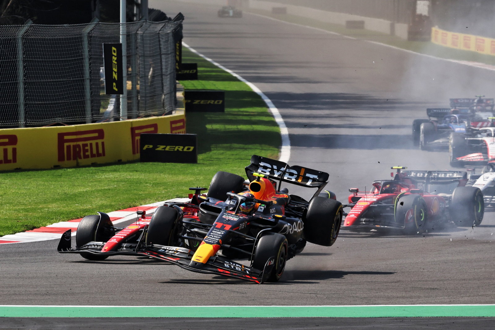 Charles Leclerc (MON) Ferrari SF-23 and Sergio Perez (MEX) Red Bull Racing RB19 - crash at the start of the race. Formula