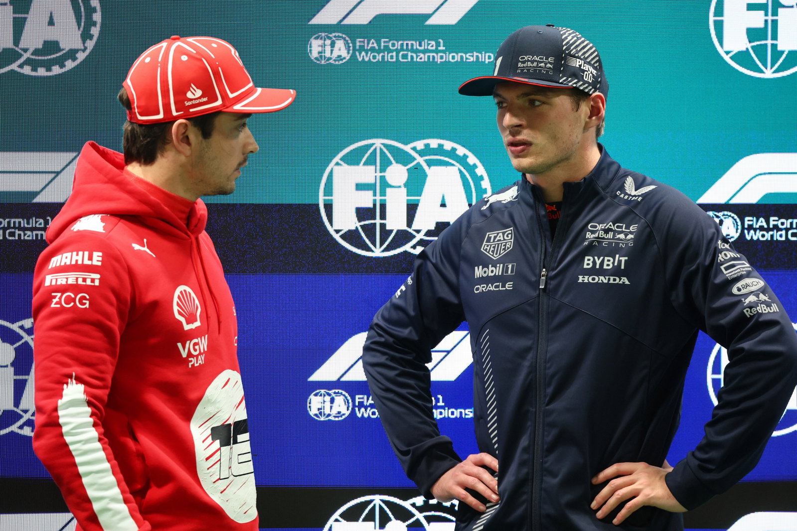 (L to R): Pole sitter Charles Leclerc (MON) Ferrari in qualifying parc ferme with third placed Max Verstappen (NLD) Red Bull