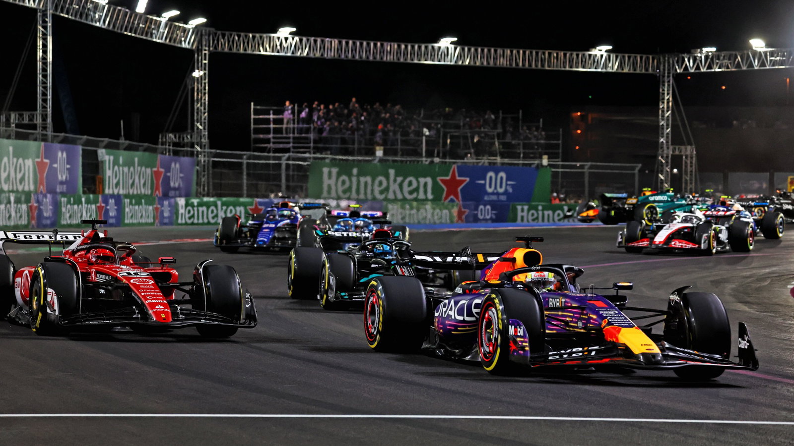 Max Verstappen (NLD) Red Bull Racing RB19 leads Charles Leclerc (MON) Ferrari SF-23 at the start of the race. Formula 1