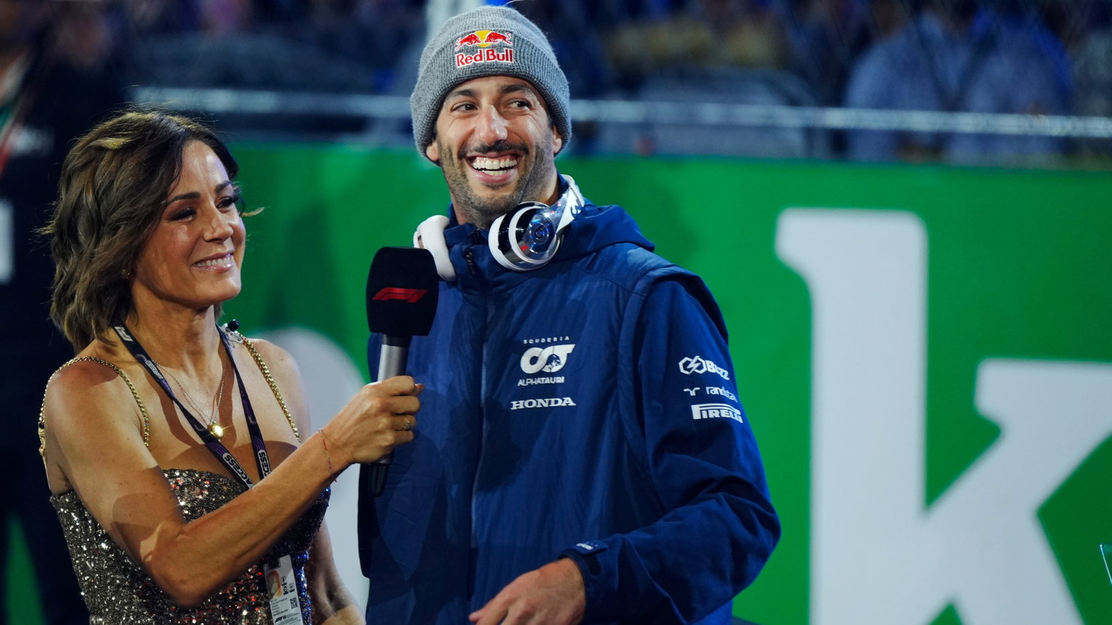(L to R): Natalie Pinkham (GBR) Sky Sports Presenter with Daniel Ricciardo (AUS) AlphaTauri on the drivers' parade.
