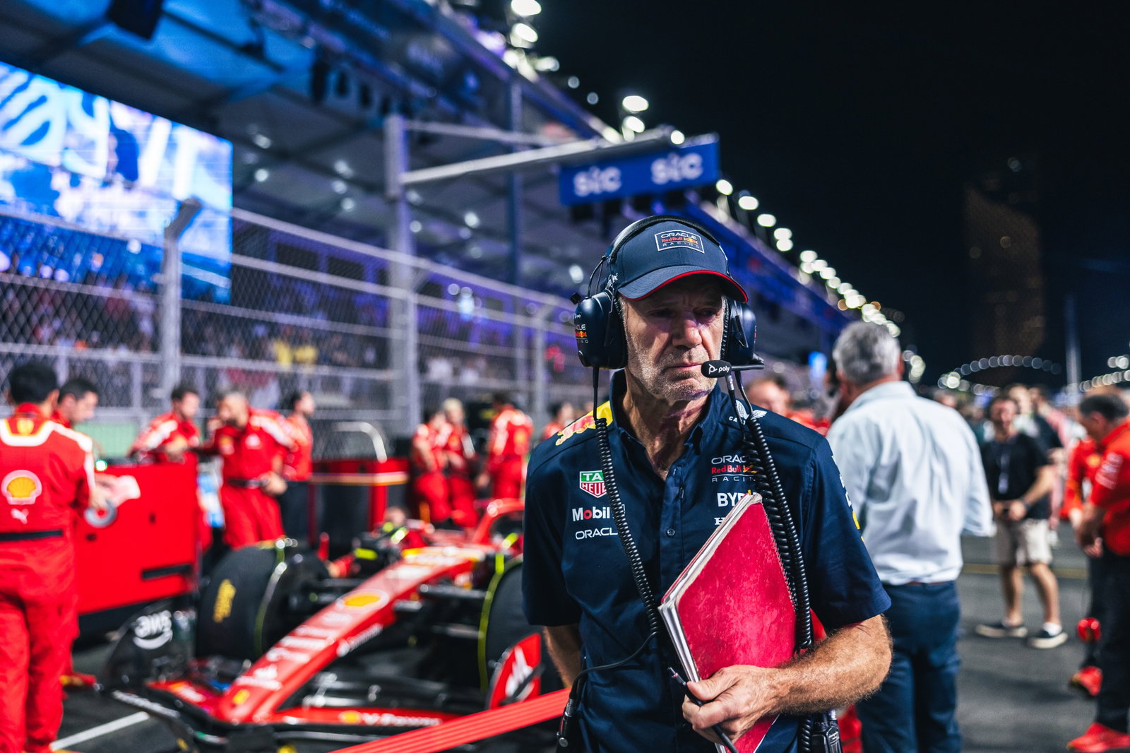 Adrian Newey (GBR) Red Bull Racing Chief Technical Officer looks at Oliver Bearman (GBR) Ferrari SF-24 Reserve Driver on the