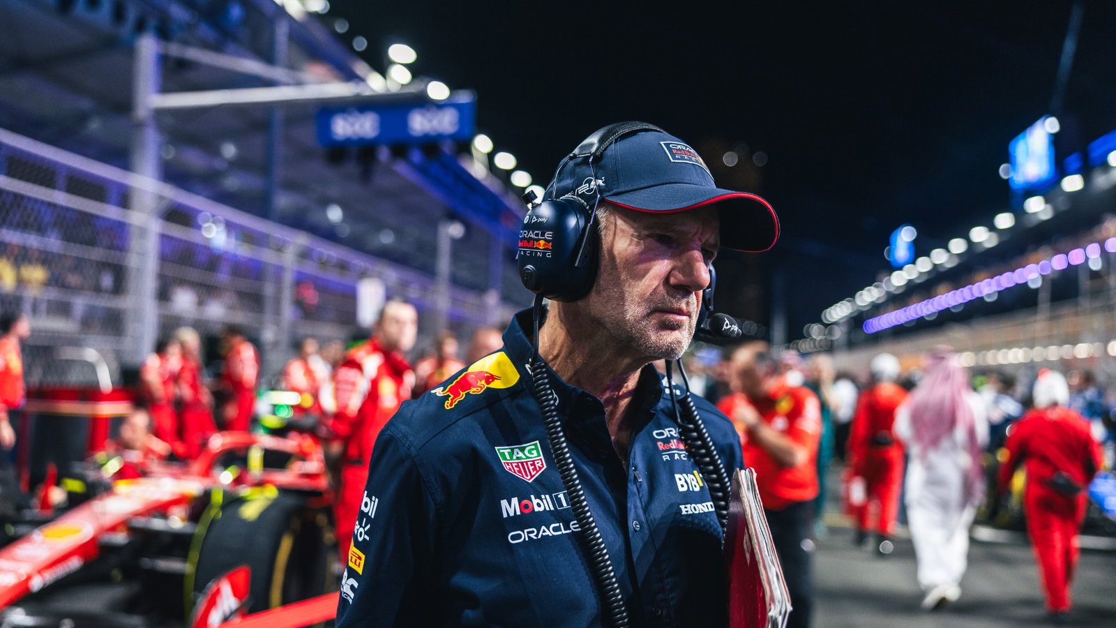 Adrian Newey (GBR) Red Bull Racing Chief Technical Officer looks at Oliver Bearman (GBR) Ferrari SF-24 Reserve Driver on the