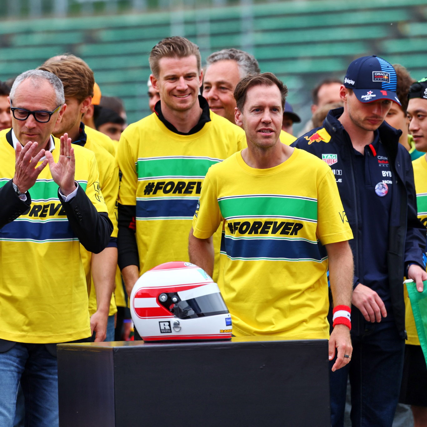 (L to R): Stefano Domenicali (ITA) Formula One President and CEO; Sebastian Vettel (GER) - Drivers and team personnel -