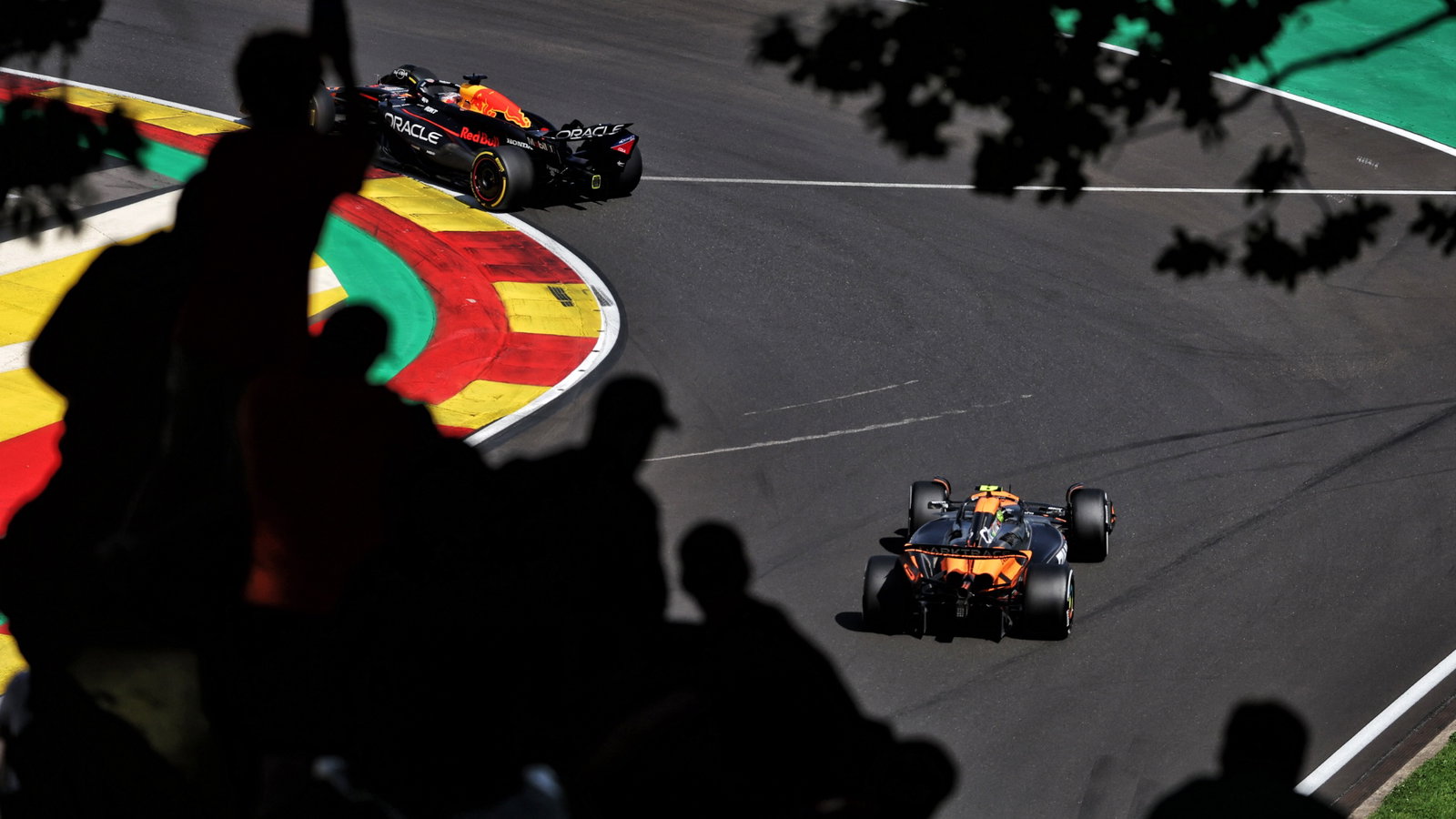 Max Verstappen (NLD) Red Bull Racing RB20 leads Lando Norris (GBR) McLaren MCL38. Formula 1 World Championship, Rd 14,